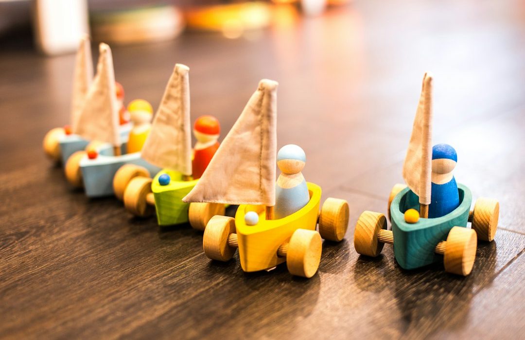 five assorted-color racing car toys