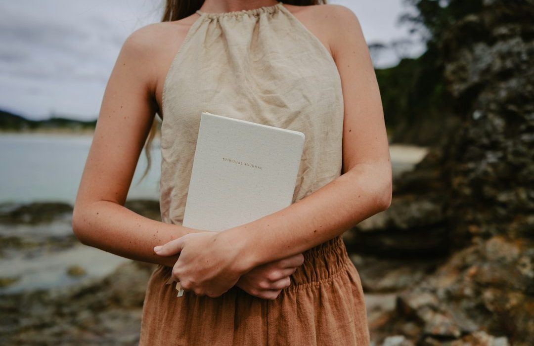 a woman holding a book in her hands